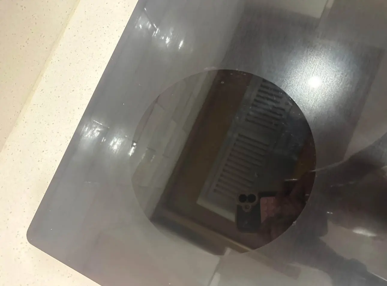 After: the same glass cooktop burner, clear and streak-free