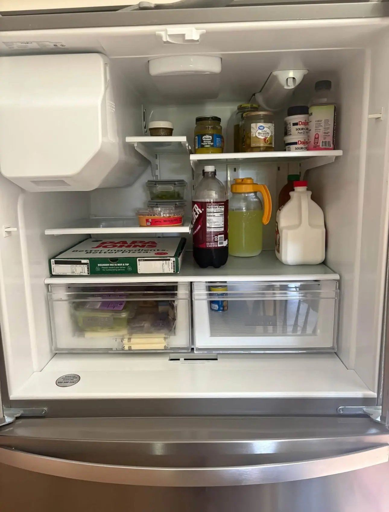 After: the same refrigerator with clean shelves, drinks grouped and drawers in order